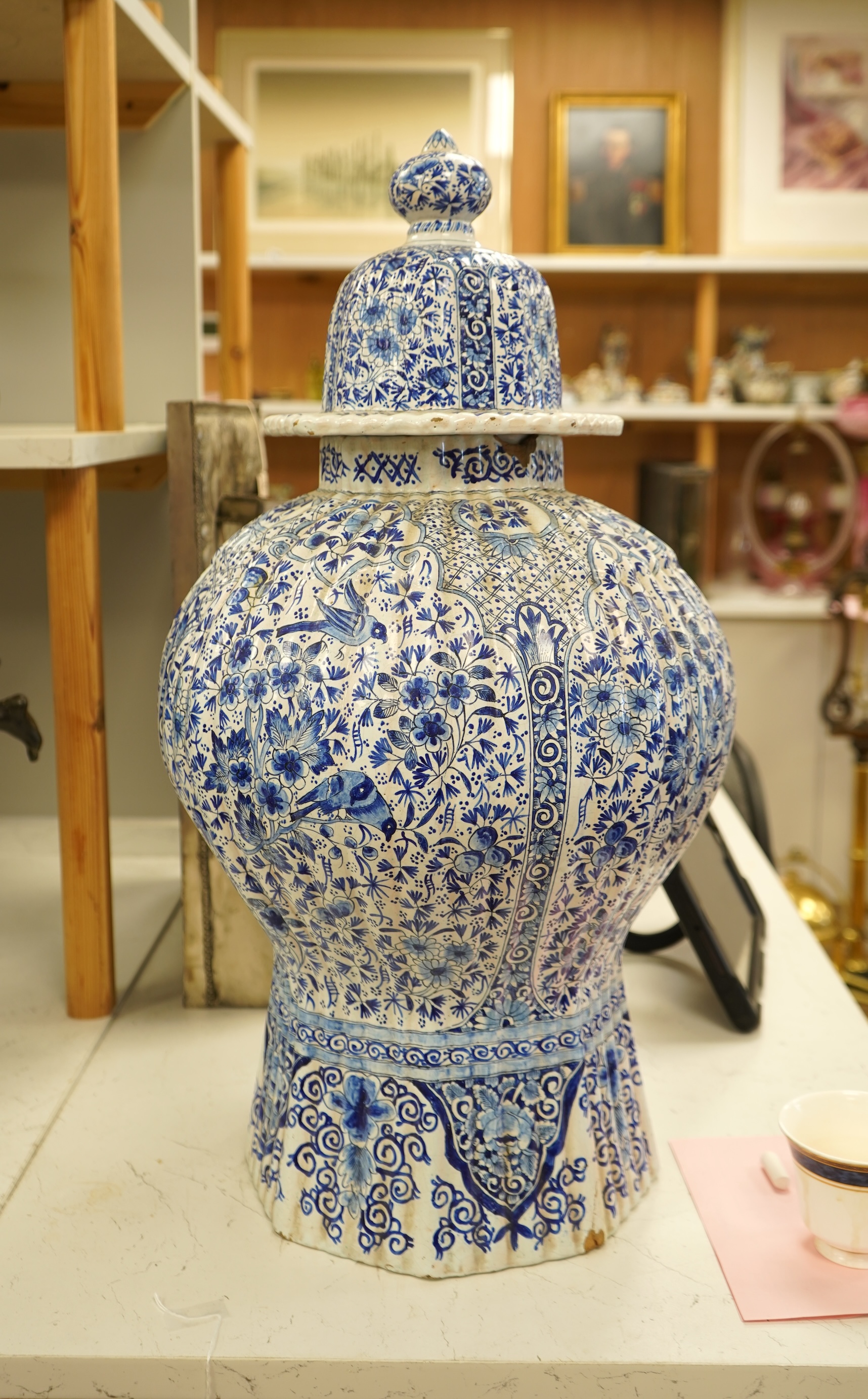 A large Delft blue and white vase and cover, 65cm tall